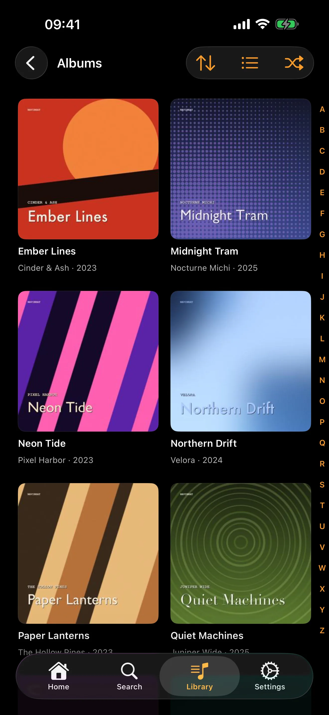 NaviBeat Albums grid on iPhone with two columns of cover art and an alphabetical index along the right edge
