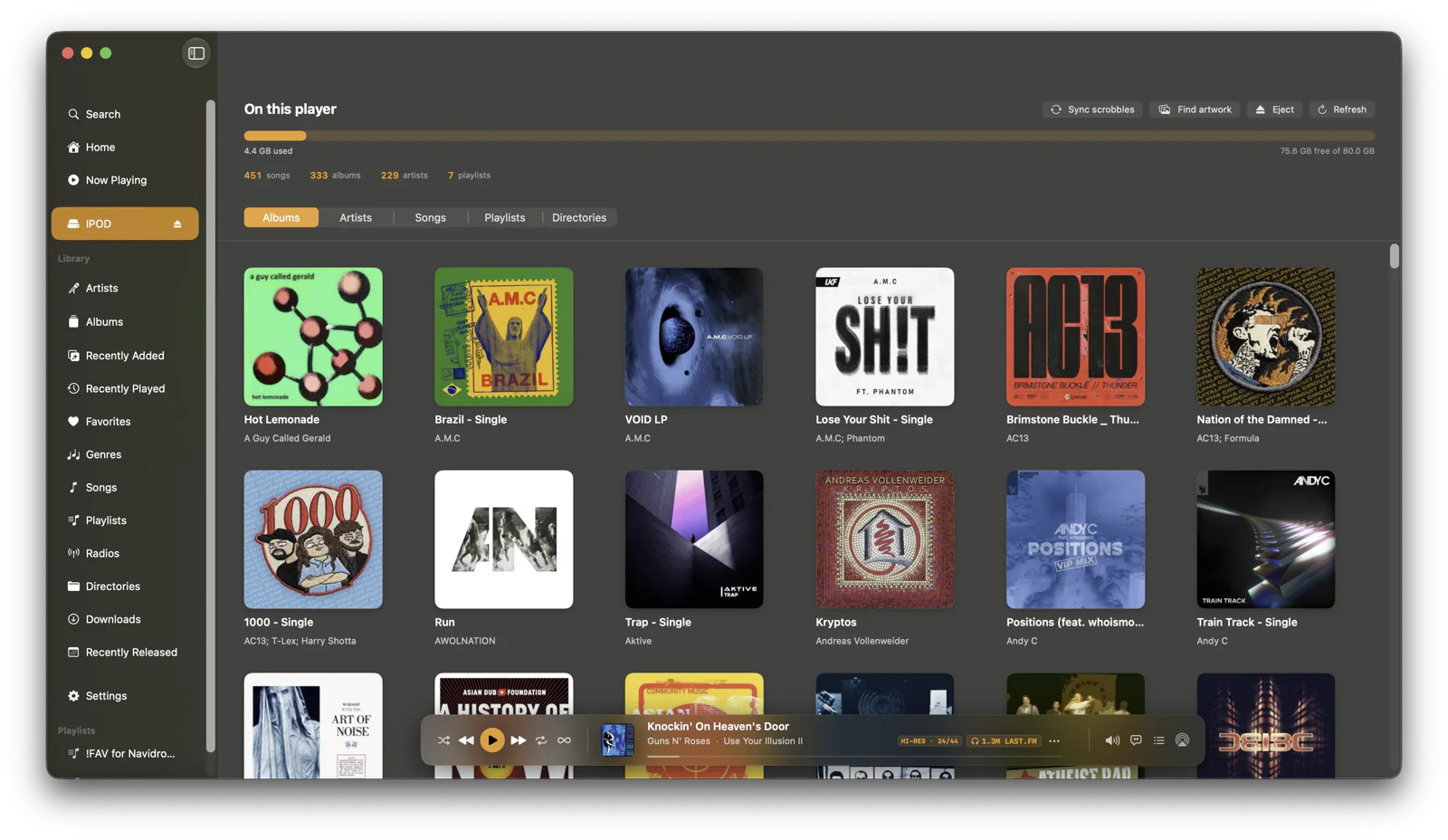The On this player screen: a grid of album covers for everything on the connected iPod, with a storage bar and song, album, artist and playlist counts.