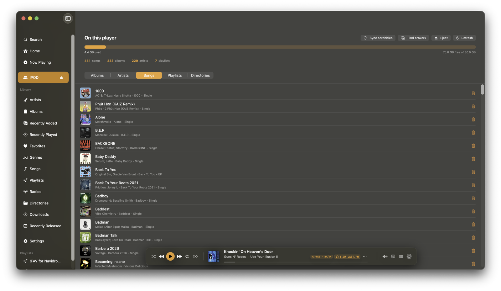 The Songs tab: a list of tracks on the device, each with its album-art thumbnail, title and artist.